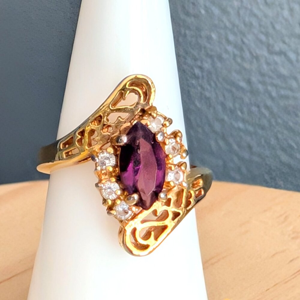 Gold tone, purple stone and faux diamond cocktail ring
